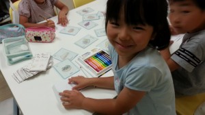 Students are all smiles as they choose what food and drink they want to take on their picnic. 